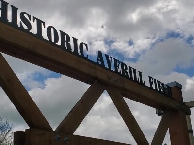Historic Averill Field sign with cloudy sky in Washington State.