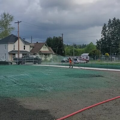 Worker hydroseeding lawn in Washington State.