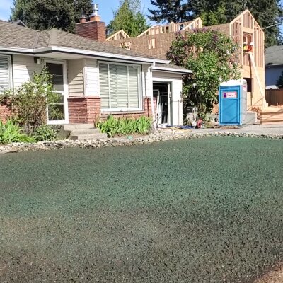 Newly hydroseeded lawn in front of a residential home.